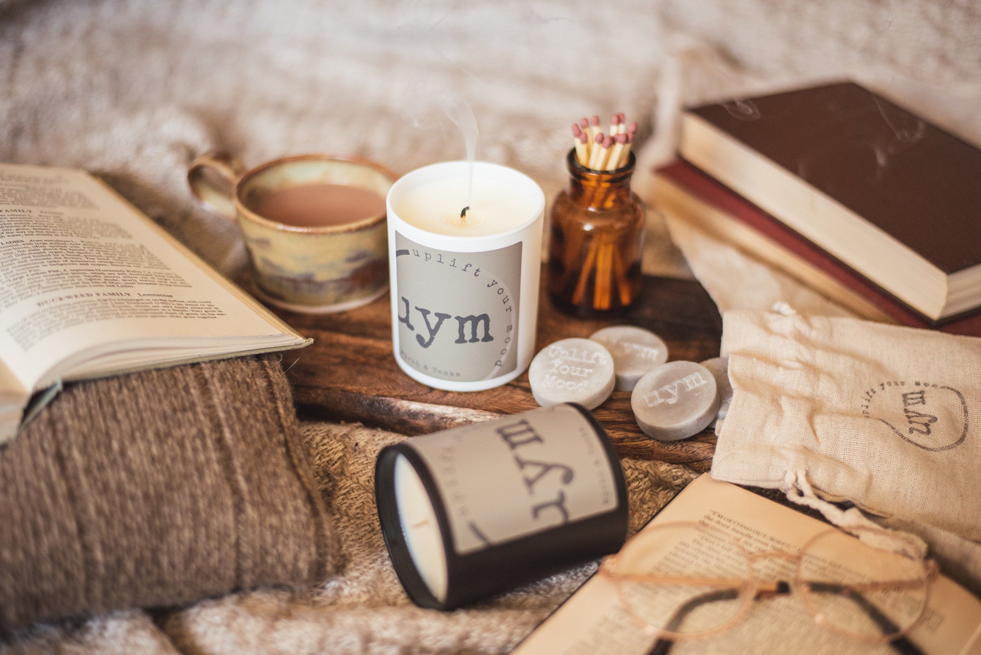 Myrrh & Tonka Candle, natural wax, matt white glass jar, matt black glass jar, natural wax melts in a lovey cotton bag, cosy atmosphere, Uplift Your Mood Scents